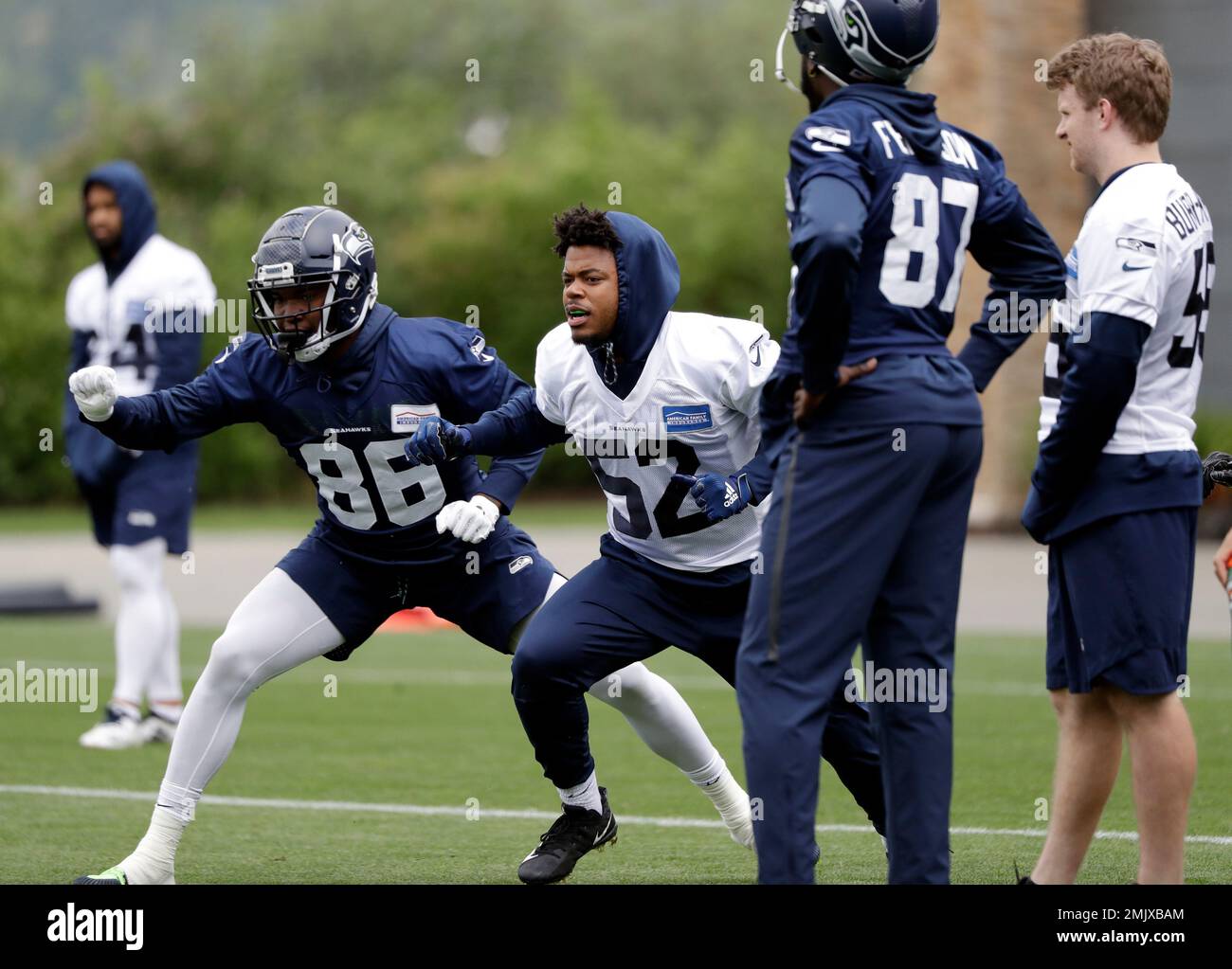 Seattle Seahawks' Justin Johnson (86) and Emmanuel Ellerbee (52