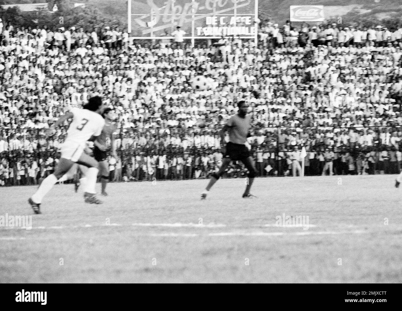 Action during the elimination match between El Salvador (dark jerseys