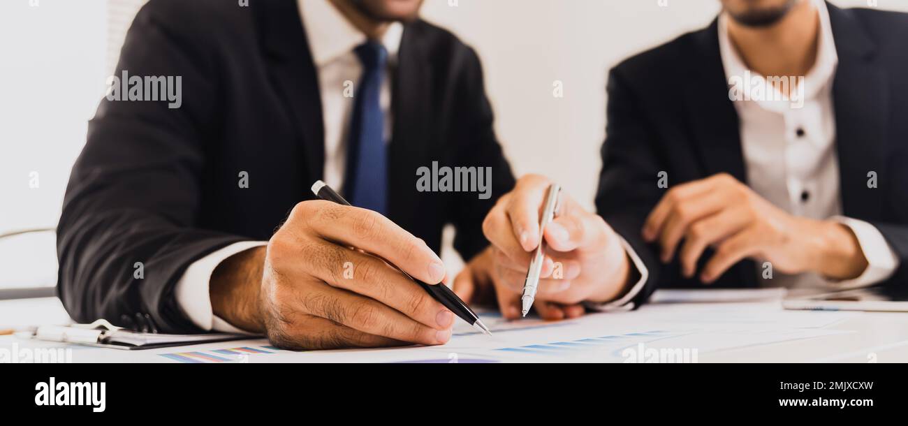 Business people advisor talking, planning analyze investment and marketing on financial graph paper in office. successful brainstorming and planning Stock Photo