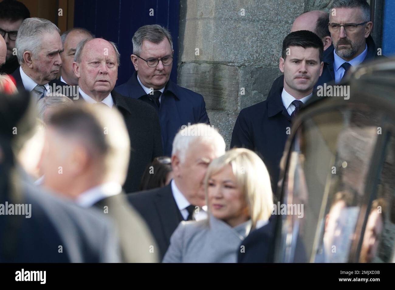 TUV leader Jim Allister (centre left ) and DUP leader Jeffrey Donaldson (centre) after the Service of Thanksgiving at Bangor Abbey in Bangor, County Down for Alex and Ann Easton, the parents of Stormont Assembly member Alex Easton who died in a house fire in Co Down. Picture date: Saturday January 28, 2023. Stock Photo