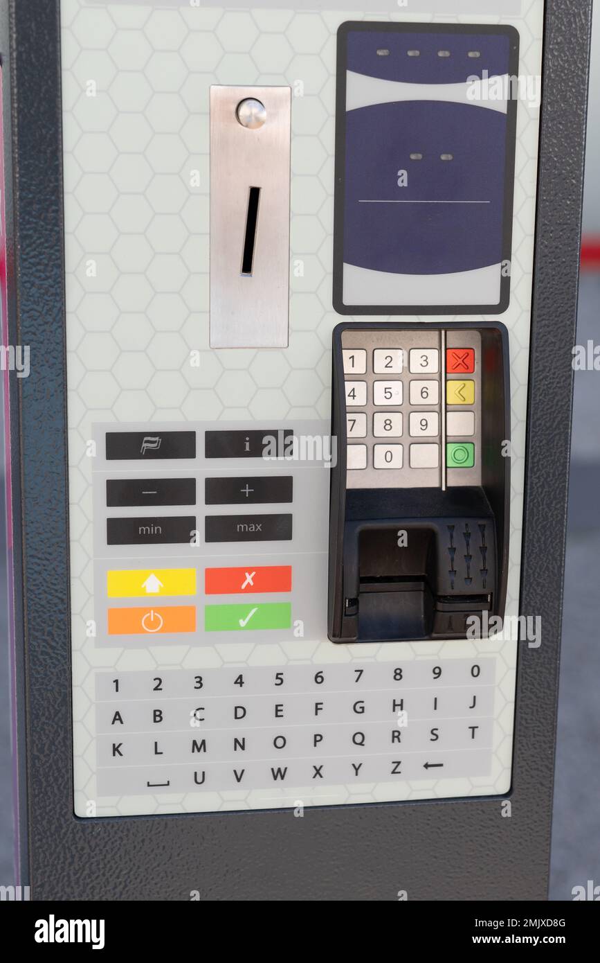 pay station terminal parking meter machine on the street ticket pay