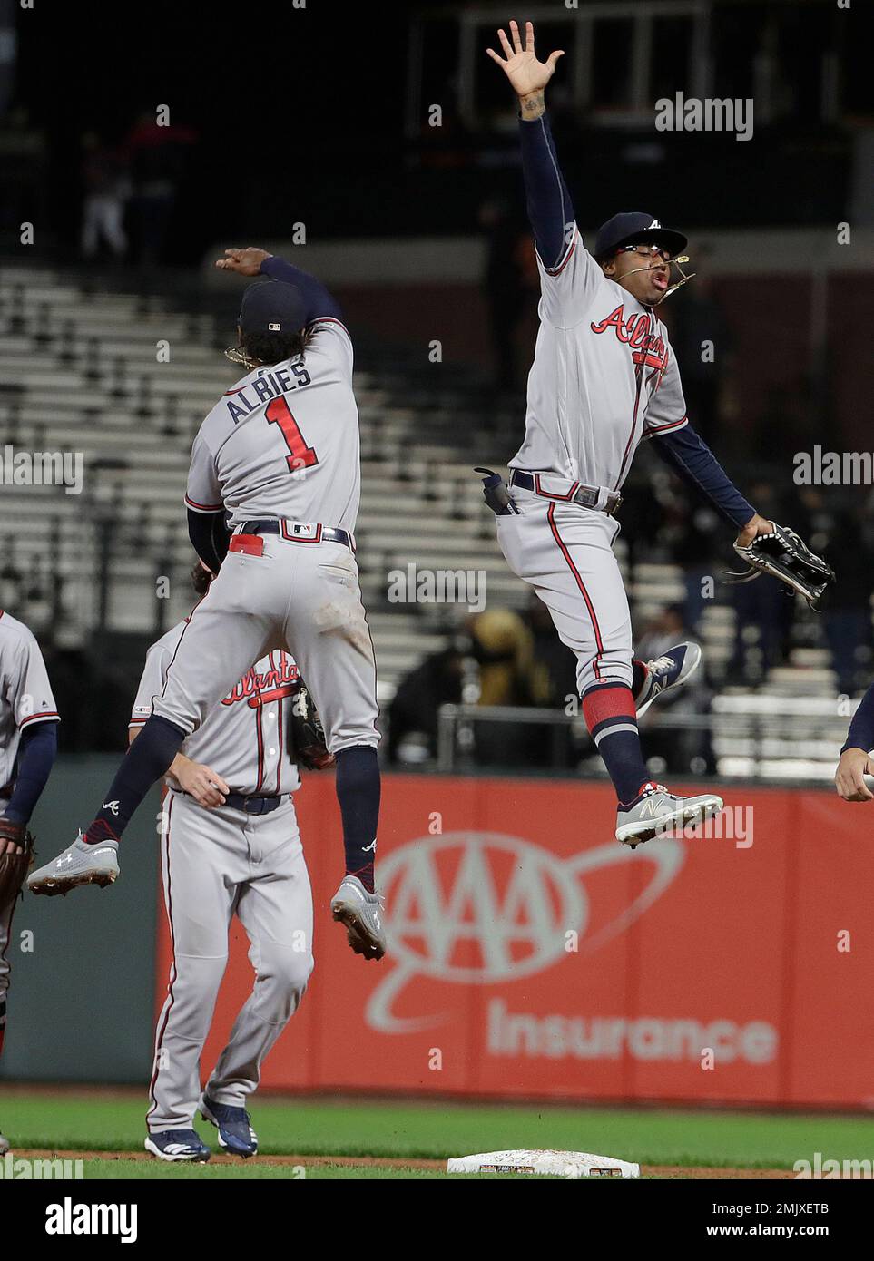 Atlanta Braves' Ozzie Albies (1) and Ronald Acuna Jr. celebrate after ...