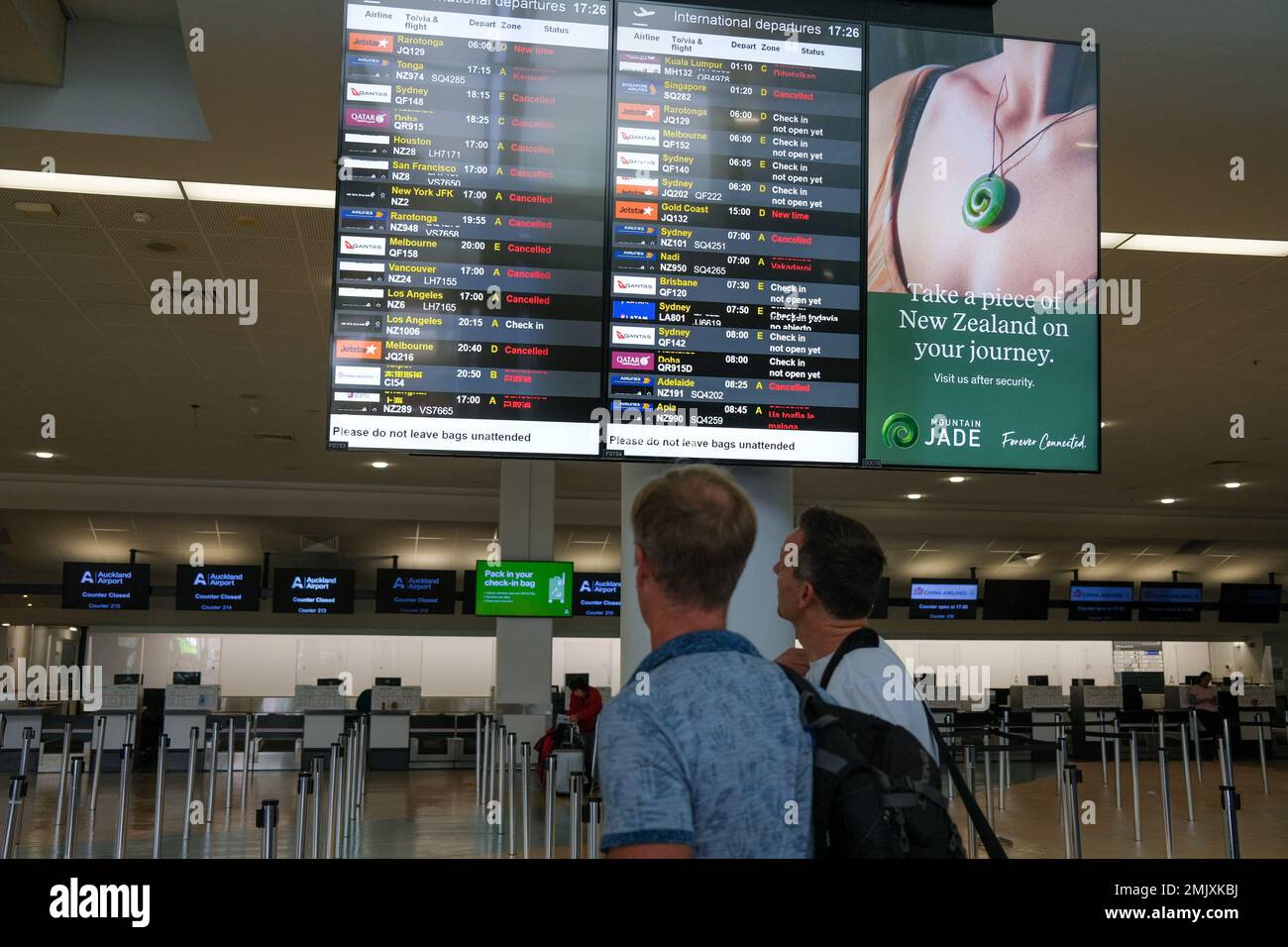 Auckland. 28th Jan, 2023. Passengers check flight information at