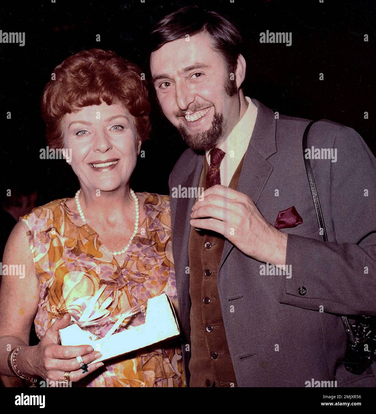 Noele Gordon, star of the tv soap Crossroads with one of the Crossroads crew the Birmingham ATV studios chief photographer Des Gershon during a studio party 1971. Stock Photo