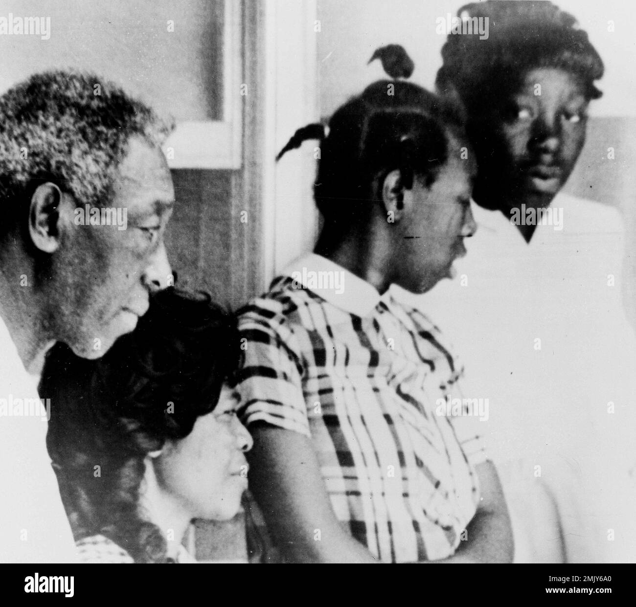 Mr. and Mrs. Lonnie Relf at left, are shown with their two daughters ...