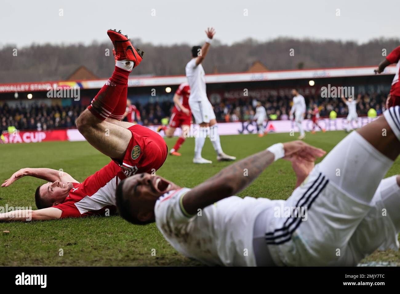 Accrington, UK. 28th Jan 2023. Junior Firpo of Leeds United is upended by Liam Coyle of Accrington Stanley during the FA Cup 4th Round match between Accrington Stanley and Leeds United at the Wham Stadium, Accrington on Saturday 28th January 2023. (Credit: Pat Scaasi | MI News) Credit: MI News & Sport /Alamy Live News Stock Photo