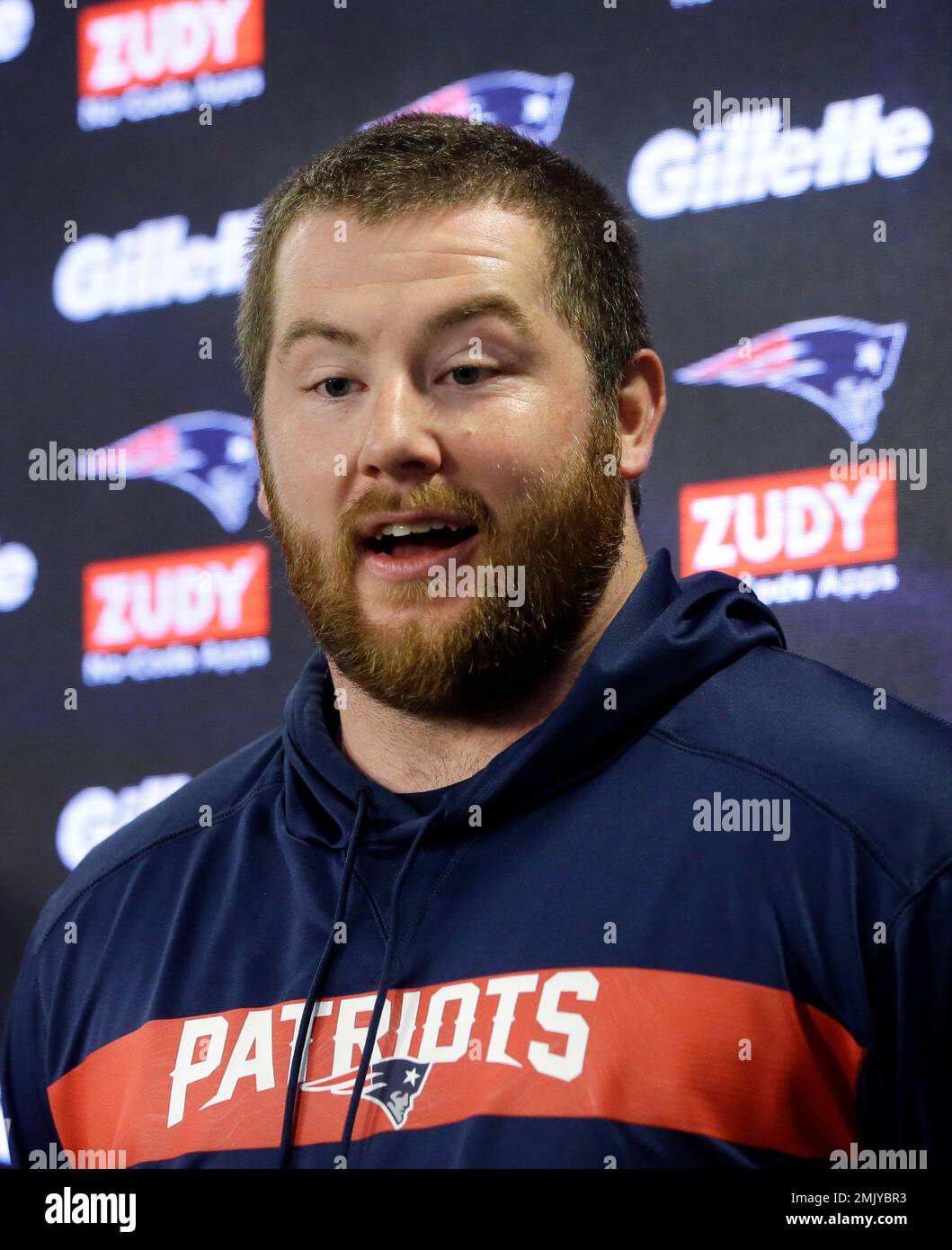 New England Patriots guard Joe Thuney faces reporters during an