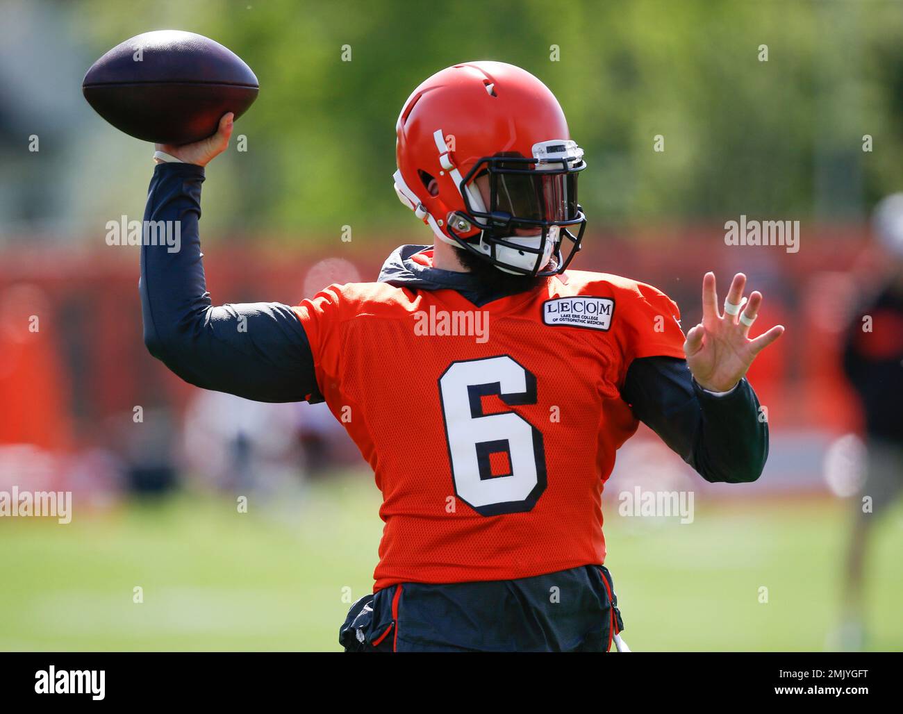 Cleveland Browns' Baker Mayfield throws a pass during an NFL football organized team activity