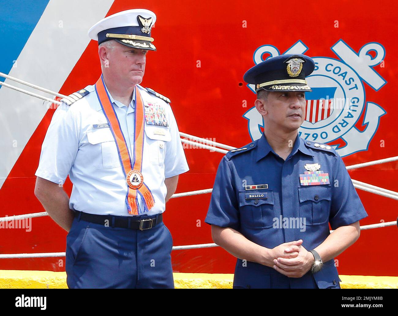 Captain John Driscoll, left, commanding officer of the U.S. Coast Guard