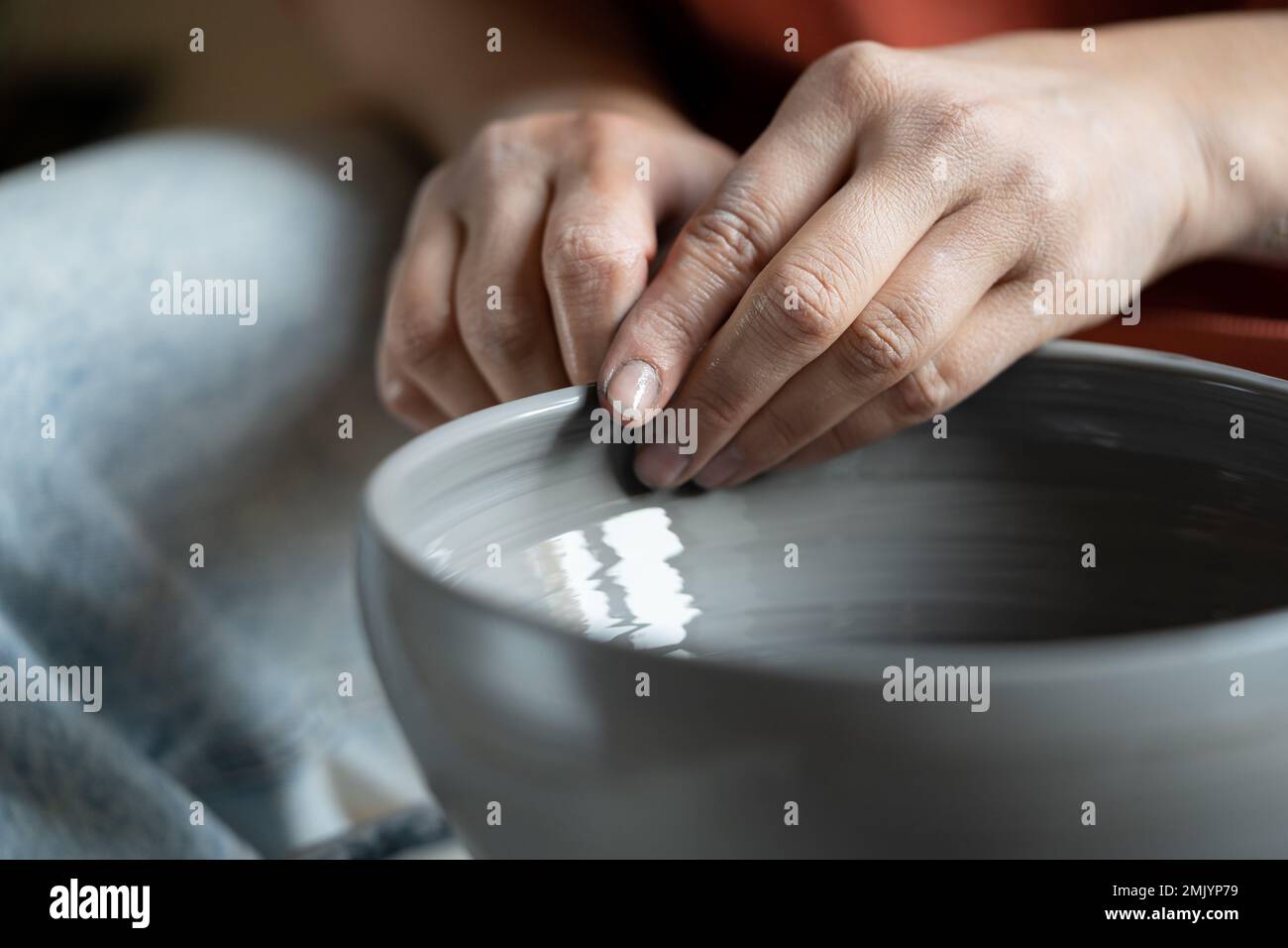 Stressrelieving hobbies, female hands molding wet clay on wheel Stock Photo Alamy