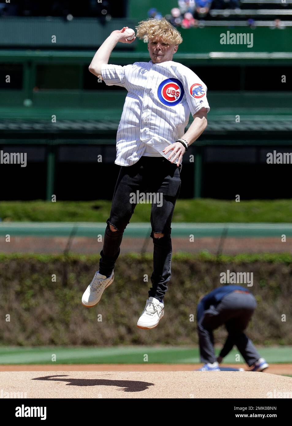 Youtube creator Tristan Jass throws out a ceremonial first pitch before a baseball game between the Milwaukee Brewers and the Chicago Cubs, Friday, May 10, 2019, in Chicago