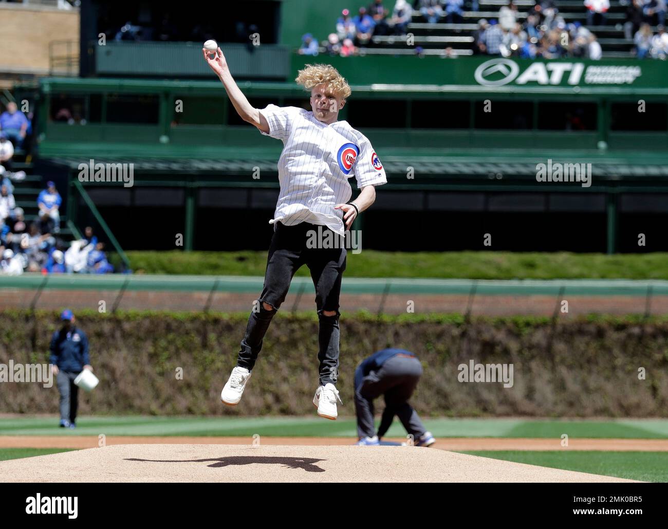 Youtube creator Tristan Jass throws out a ceremonial first pitch before a baseball game between the Milwaukee Brewers and the Chicago Cubs, Friday, May 10, 2019, in Chicago