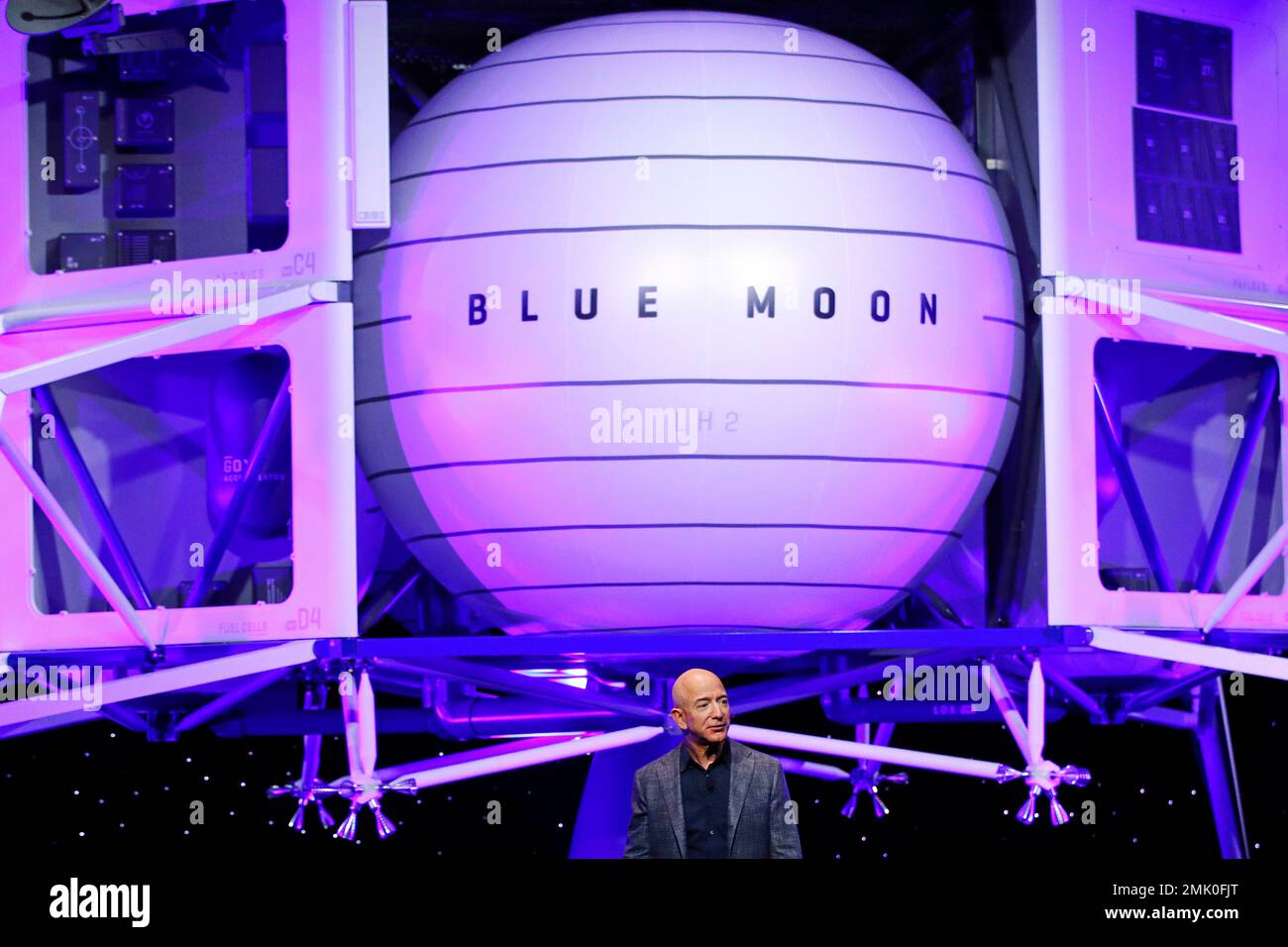 Jeff Bezos speaks in front of a model of Blue Origin's Blue Moon lunar