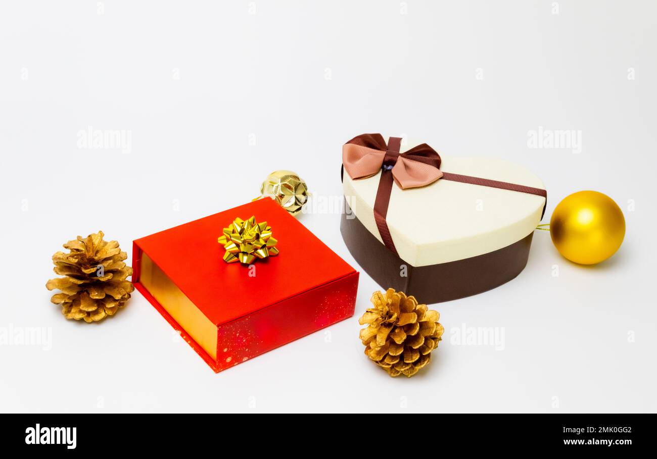 Red box on white background, heart shaped box with grey bag on white ...