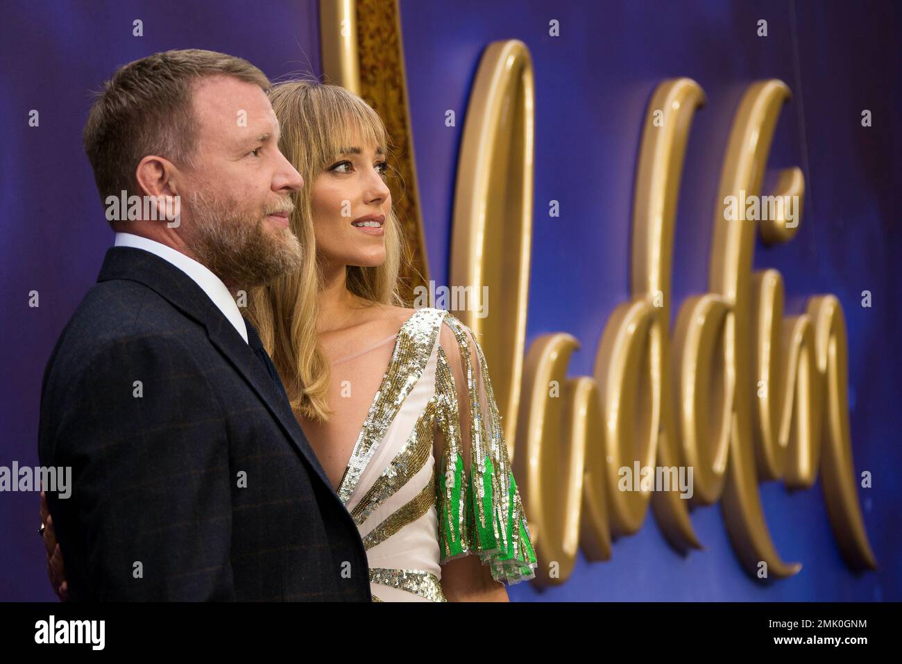 Director Guy Ritchie and Jacqui Ainsley pose for photographers upon ...
