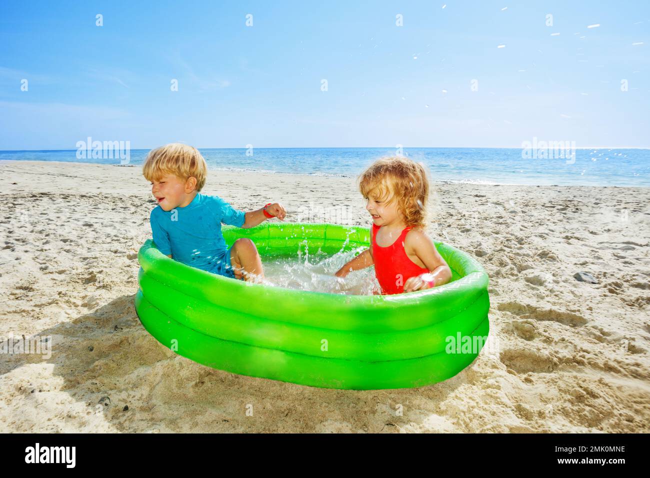 Kids play in water hi-res stock photography and images - Alamy
