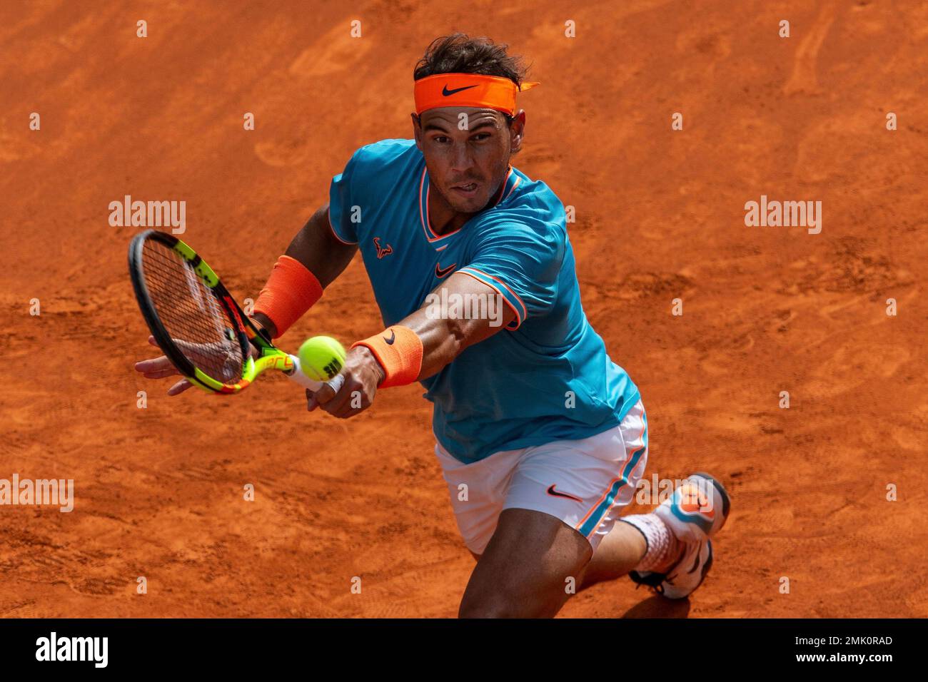 Rafael Nadal, from Spain, returns the ball to Felix Auger-Aliassime, from Canada, during the Madrid Open tennis tournament in Madrid, Wednesday, May 8, 2019
