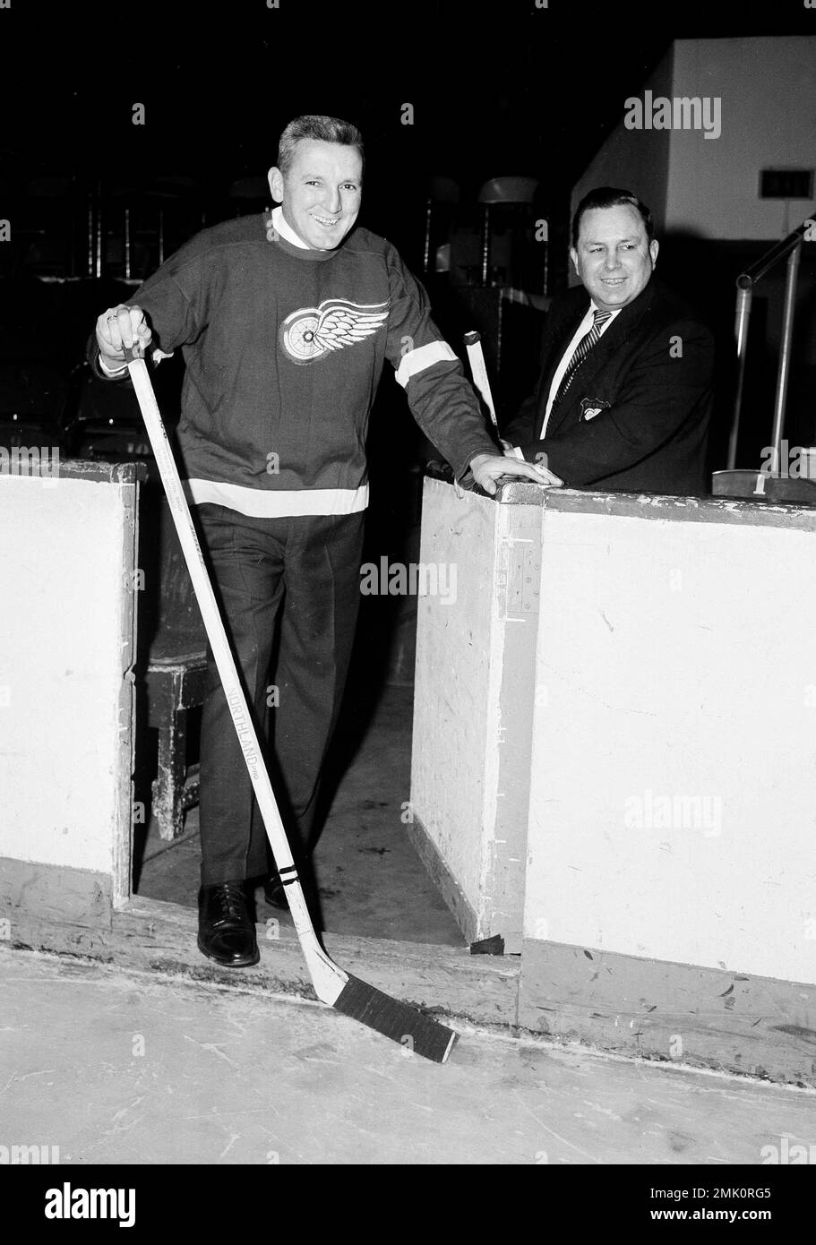 Sid Abel, left, a Detroit Red Wings player from 1938 to 1952, inspects the ice at Olympia Stadium in Detroit, Jan