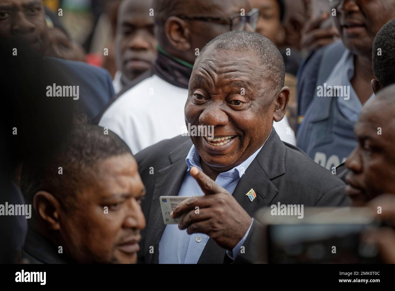 President Cyril Ramaphosa greets supporters after casting his vote at ...