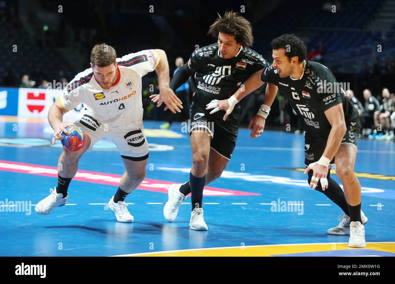Johannes Golla of Germany, Ali Mohamed and Ibrahim Elmasry of Egypt during the IHF Men's World Championship 2023, placement matches 5-8, Handball match between Germany and Egypt on January 27, 2023 at Tele2 Arena in Stockholm, Sweden - Photo Laurent Lairys / DPPI Stock Photo