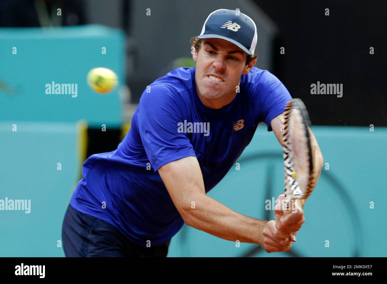 Reilly Opelka, from the United States, returns the ball during his match against Dominic Thiem, from Austria, during the Madrid Open tennis tournament, Tuesday, May 7, 2019, in Madrid, Spain