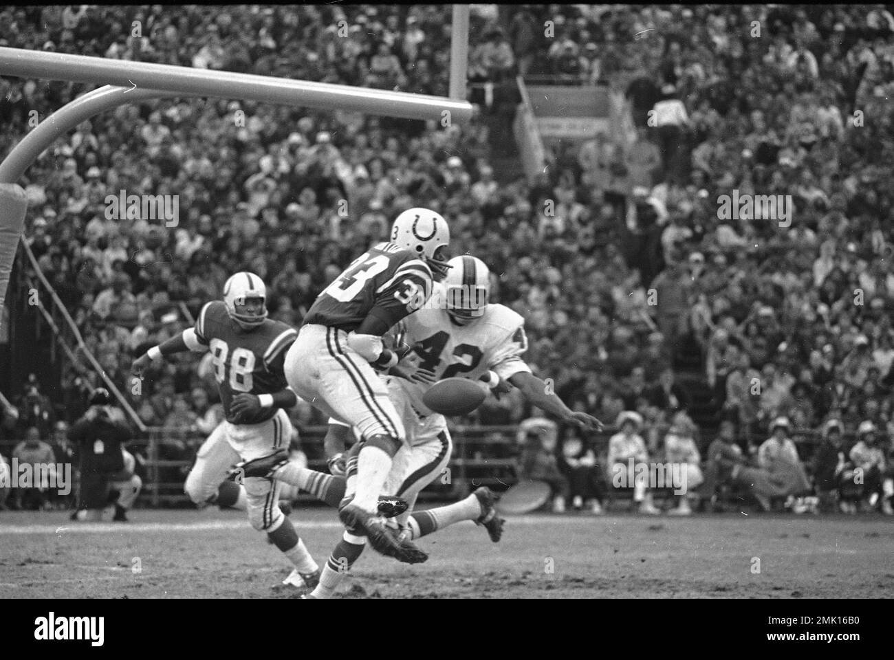 Wide receiver Ed Hinton missed this pass from quarterback Johnny Unitas as  the Baltimore Colts ground to a 17-17 tie with upstart Buffalo Bills, at  Baltimore, Nov. 16, 1970. Corner back George