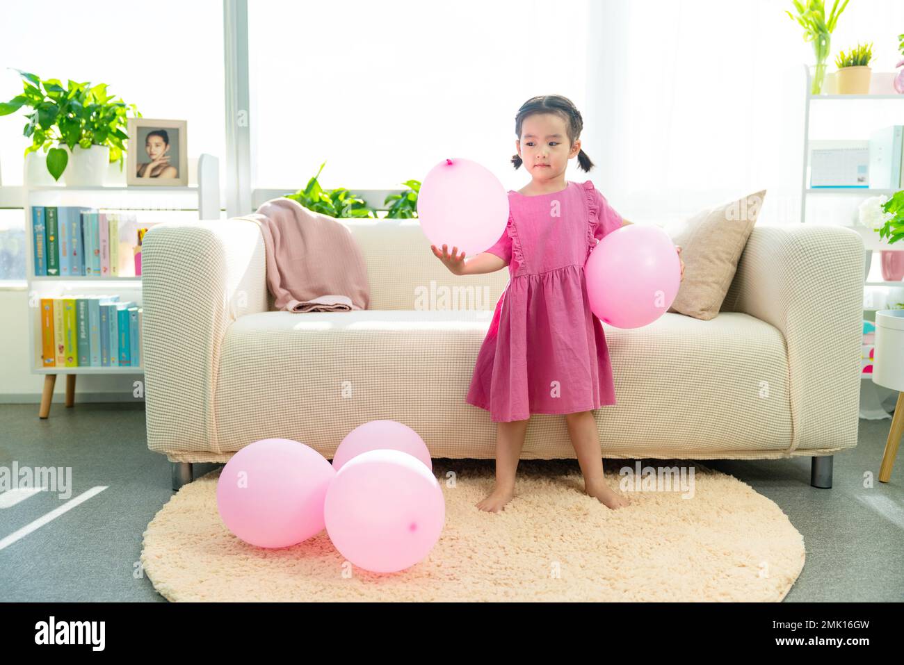 Happy little girl and the balloon Stock Photo