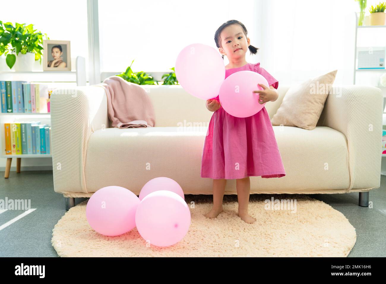 Happy little girl and the balloon Stock Photo