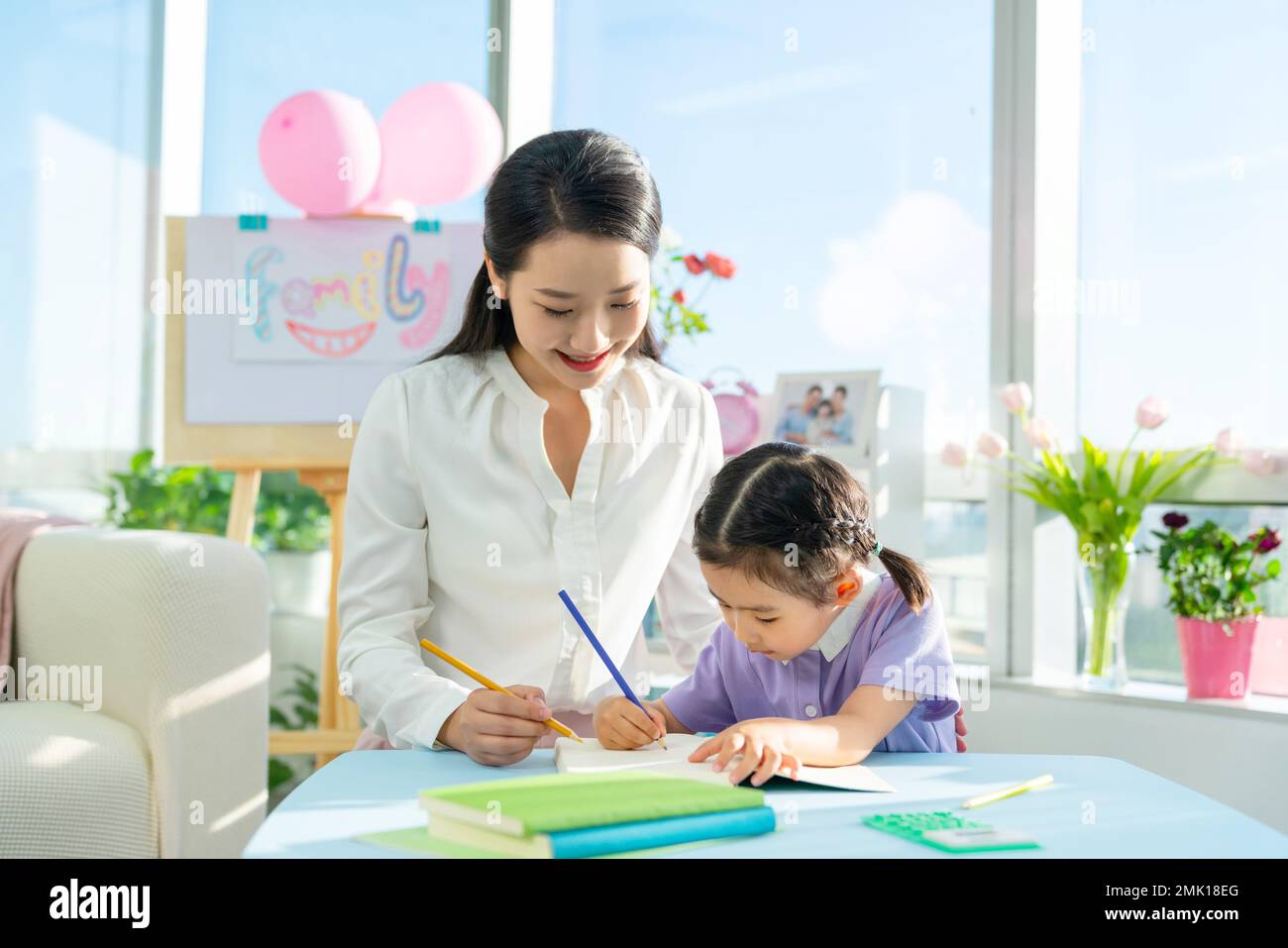 The teacher taught the girl reading a book Stock Photo Alamy
