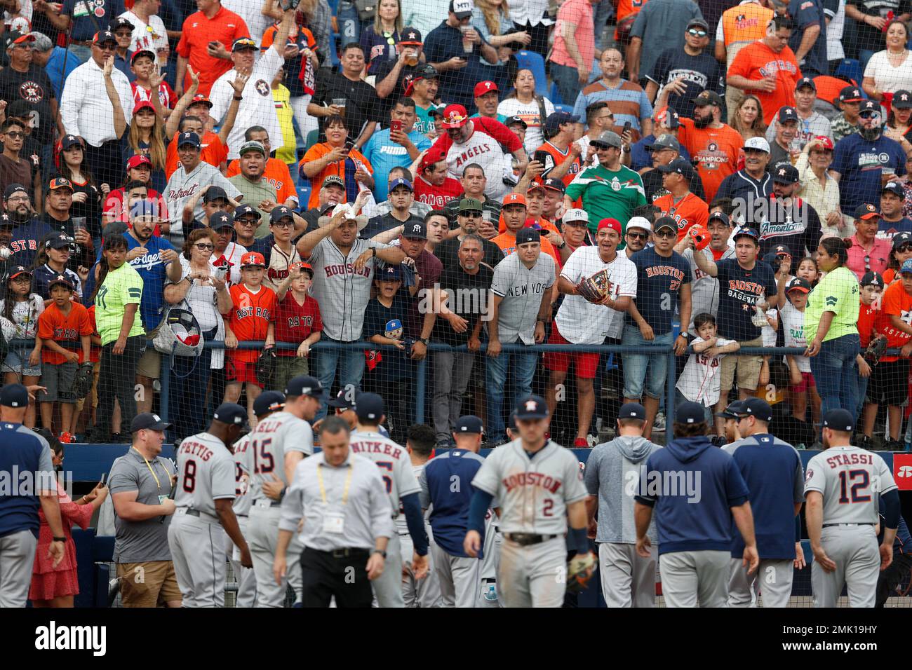 Fans call out to Houston Astros players from above the dugout after the  Astros defeated the Los Angeles Angels 10-4 in their second baseball game,  in Monterrey, Mexico, Sunday, May 5, 2019. (