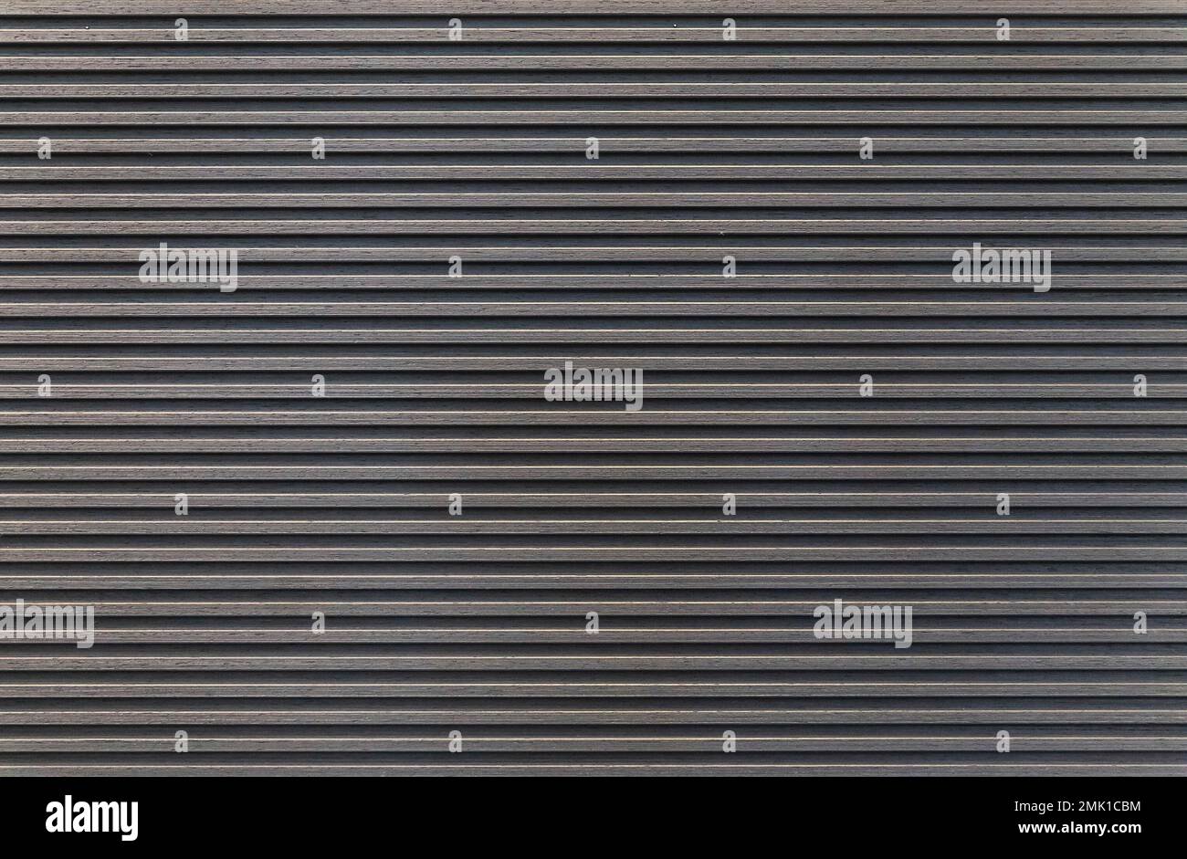 Dark striped wooden wall. Interior element Stock Photo