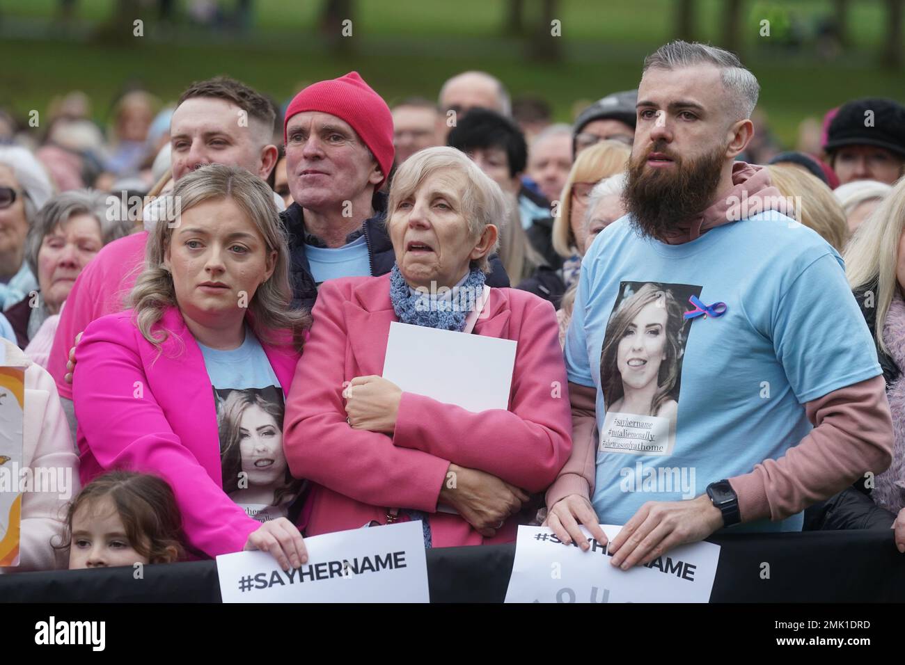 Murder victim Natalie McNally parents, mother Bernie and father Noel, with brother Niall (right) join people at a vigil at Lurgan Park in Lurgan, Co Armagh in memory of their daughter and opposing violence against women. Picture date: Saturday January 28, 2023. Stock Photo