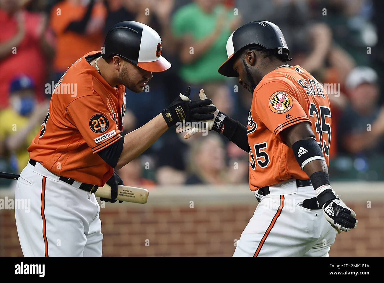 Baltimore Orioles' Dwight Smith Jr., right, is congratulated by