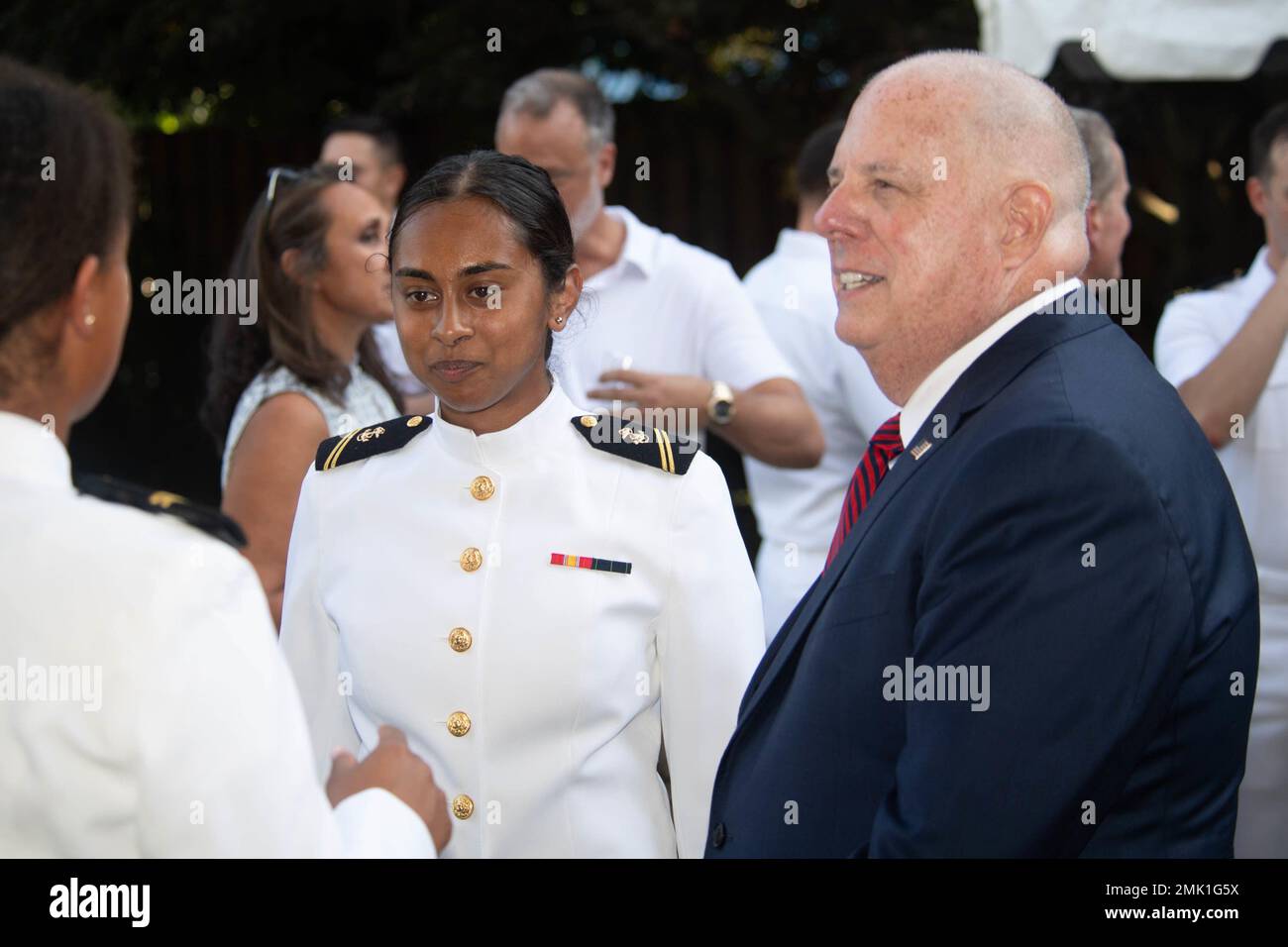 ANNAPOLIS, Md. (Sept. 2, 2022) Maryland Gov. Larry Hogan speaks with guests at the first parade reception at Buchanan House. As the undergraduate college of our country’s naval service, the Naval Academy prepares young men and women to become professional officers of competence, character, and compassion in the U.S. Navy and Marine Corps. Stock Photo