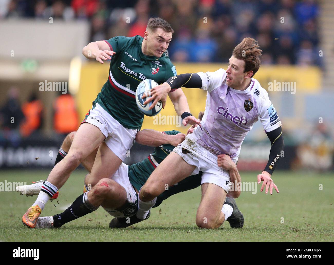 Leicester Tigers’ Matt Scott (left) and Guy Porter tackle Northampton Saints’ James Ramm during the Gallagher Premiership match at the Mattioli Woods Welford Road Stadium, Leicester. Picture date: Saturday January 28, 2023. Stock Photo
