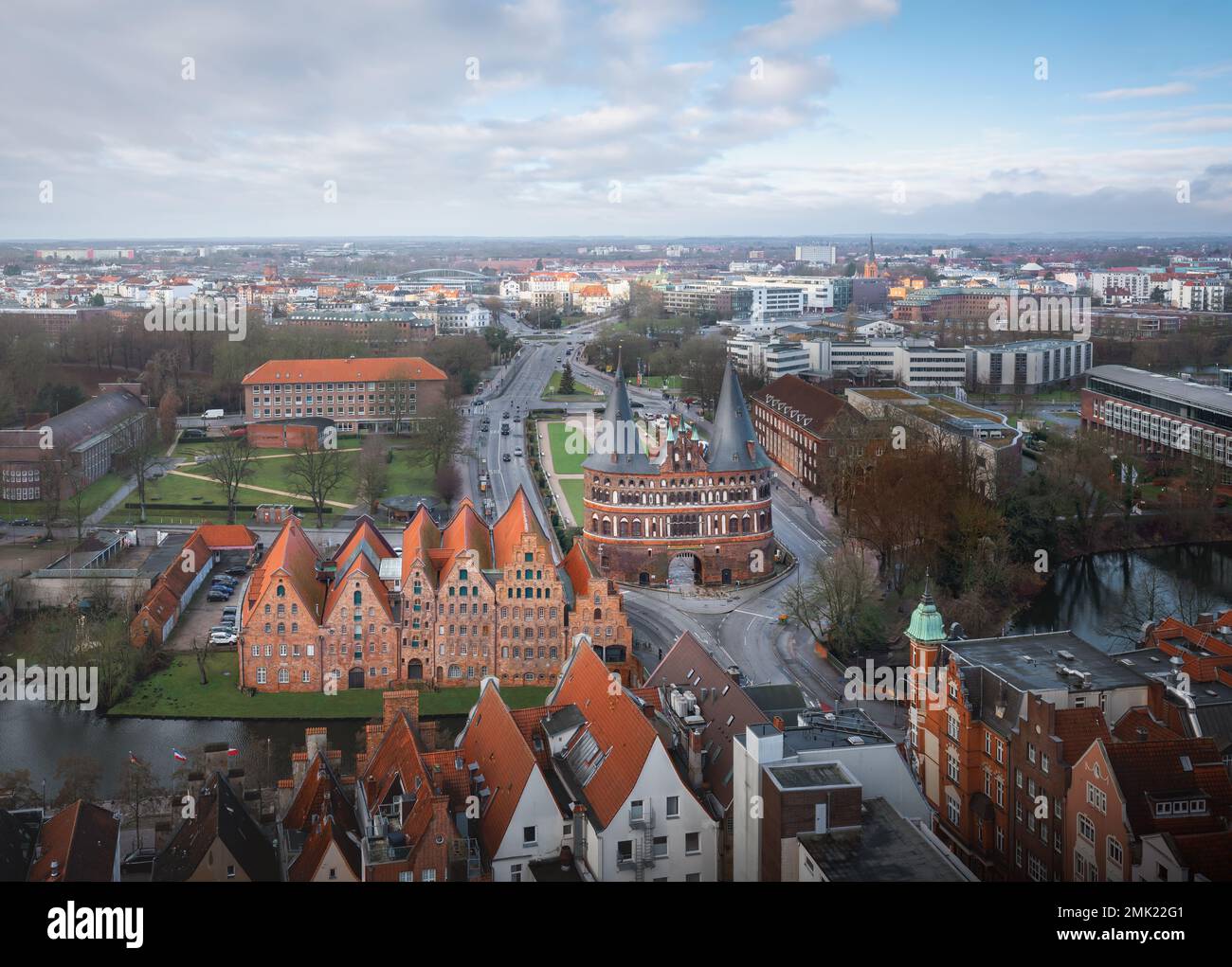 Aerial view of Lubeck with Holstentor (Holsten Gate) and Salzspeicher buildings - Lubeck, Germany Stock Photo