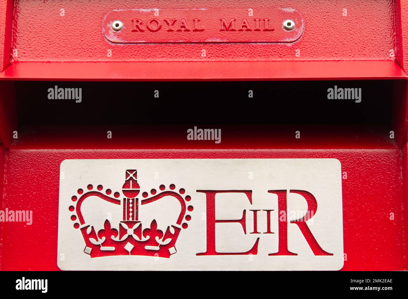 Close up of a Royal Mail postbox letter opening with the Royal Cypher of the late Queen Elizabeth 11, E11R. Stock Photo