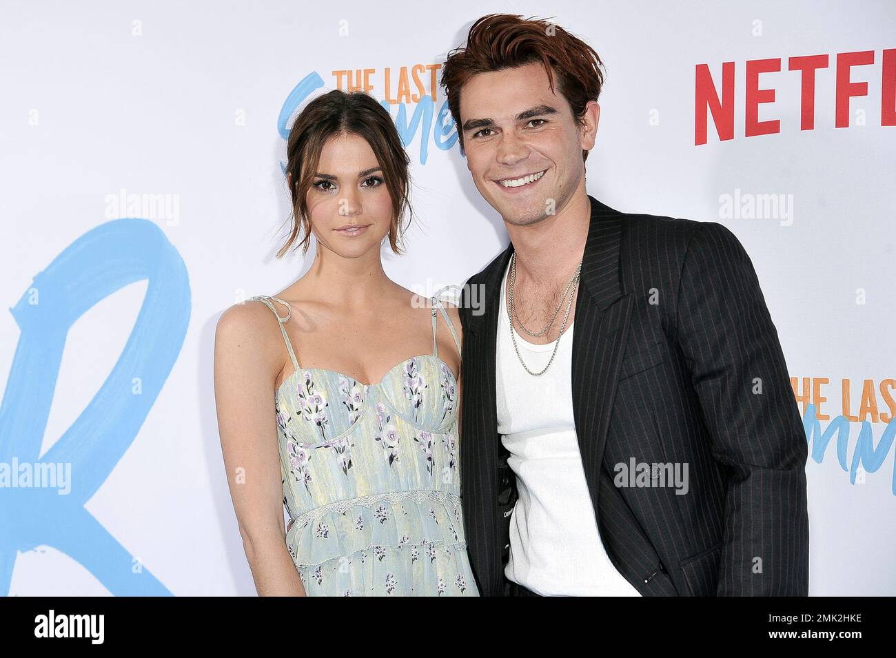 Maia Mitchell, left, and KJ Apa attend the LA premiere of "The Last