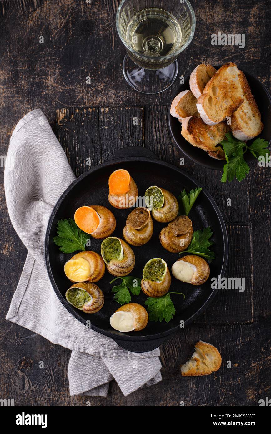 Baked snails Escargot with bread Stock Photo Alamy