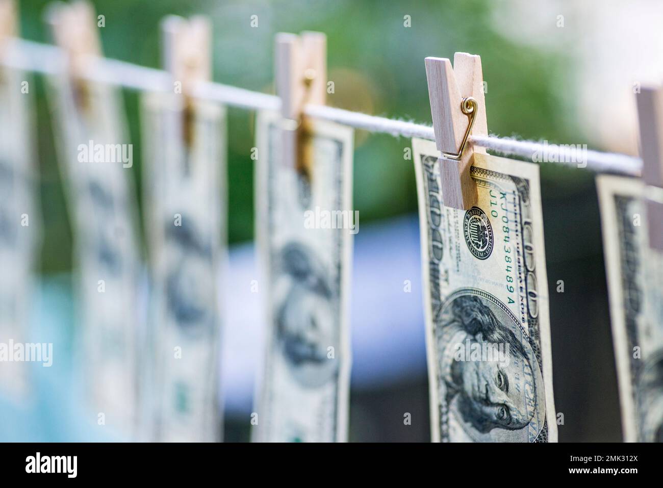 Money Laundering. Money Laundering US dollars hung out to dry.  Stock Photo