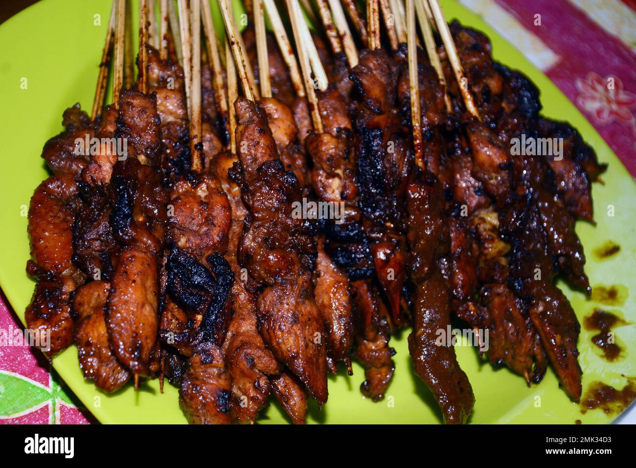 Close up photo of chicken satay, a dish of grilled meat and served with peanut sauce Stock Photo