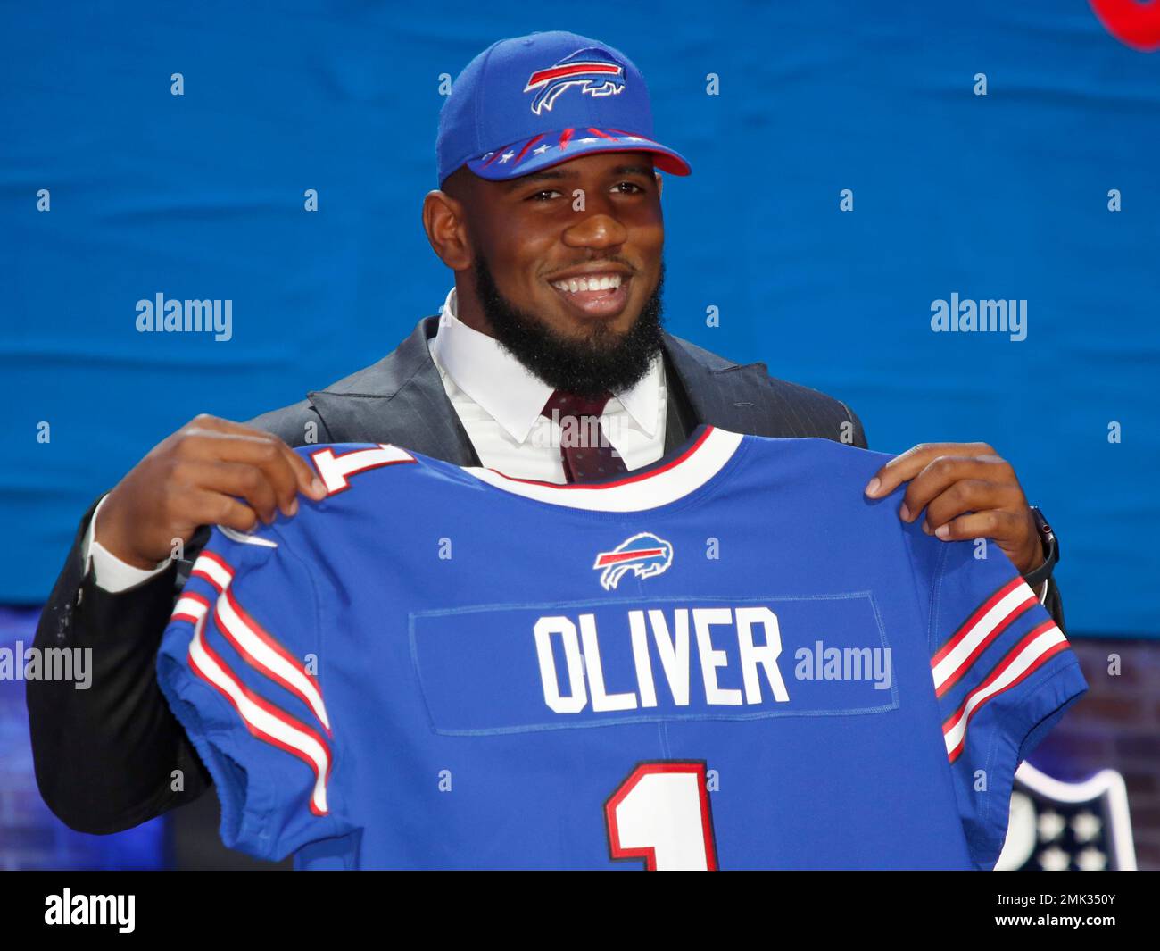 Houston defensive tackle Ed Oliver poses with his new team jersey after the  Buffalo Bills selected Oliver in the first round at the NFL football draft,  Thursday, April 25, 2019, in Nashville,