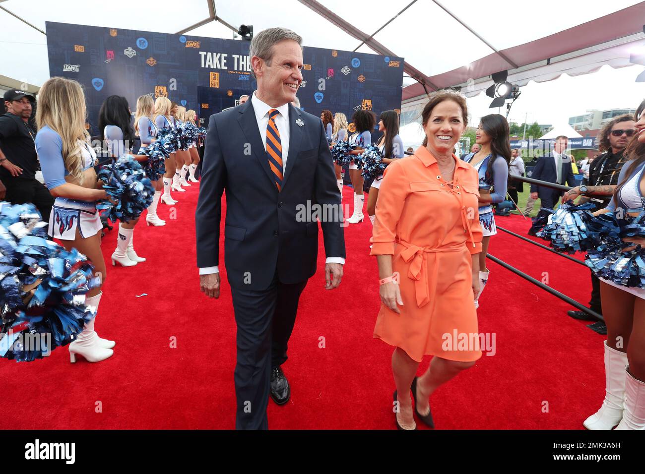 Tennessee governor Bill Lee, left, and his wife Maria Lee walk the NFL
