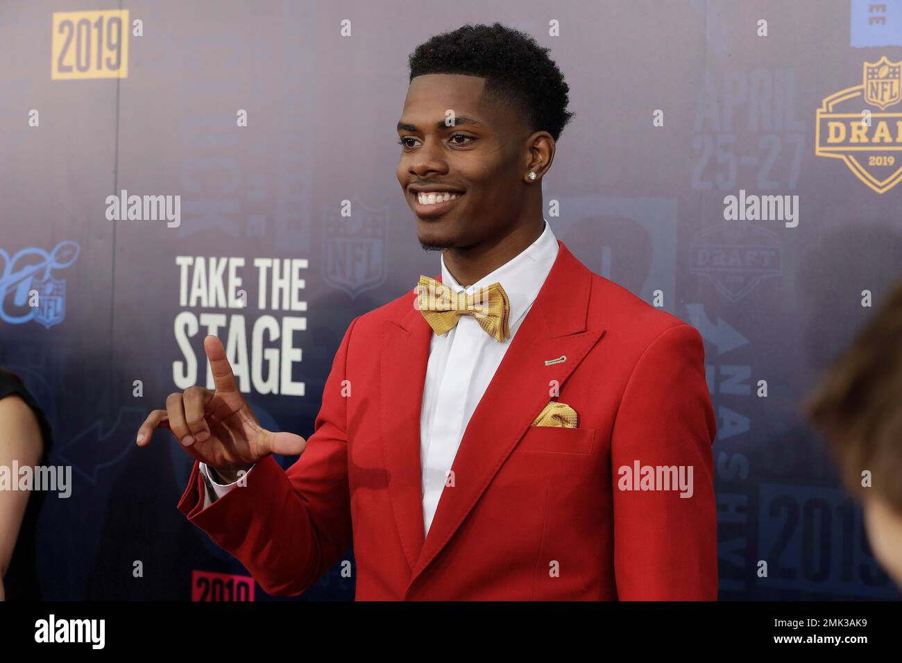 Louisiana State cornerback Greedy Williams walks the red carpet ahead