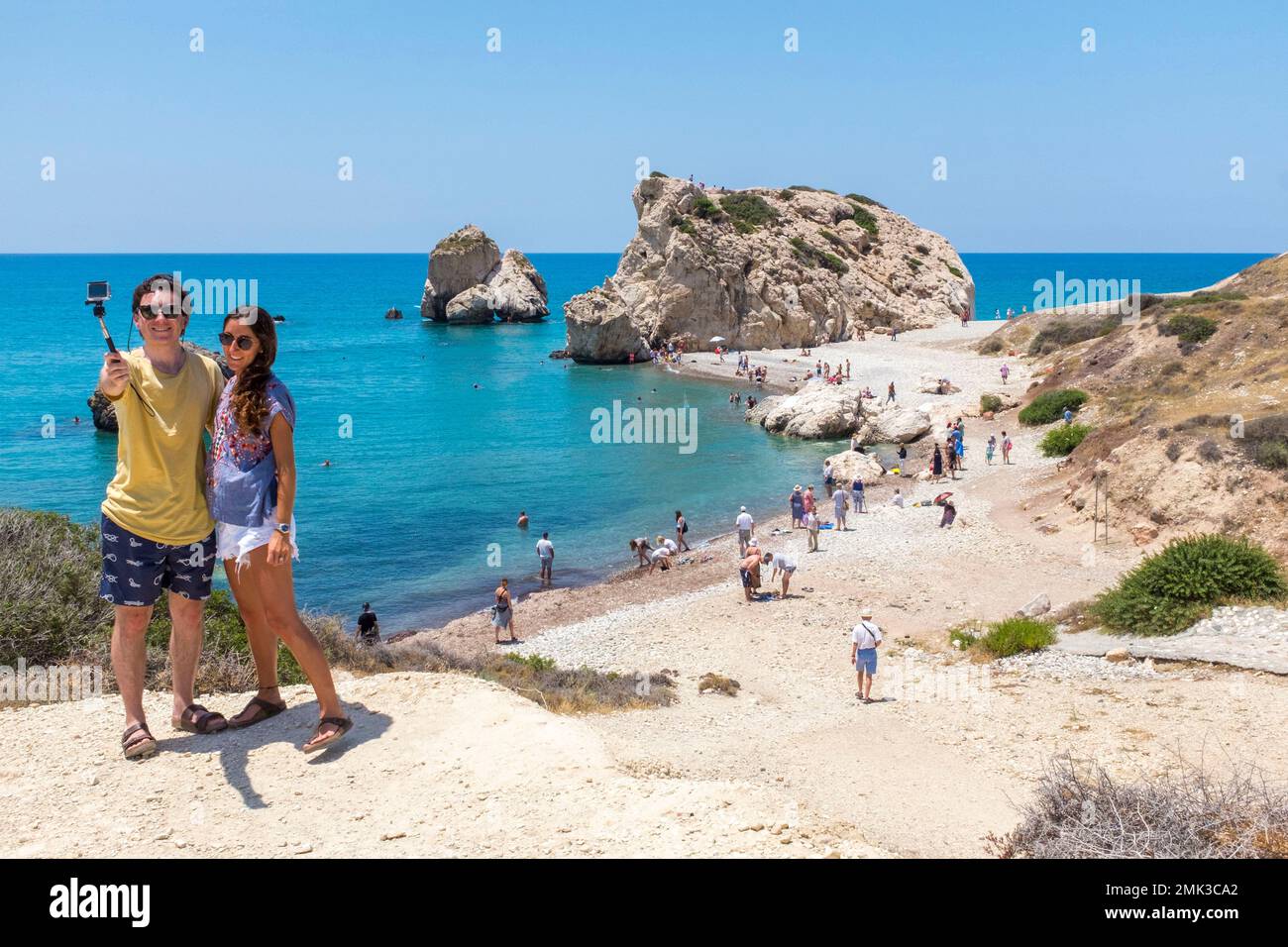Tourists do a selfie at Aphrodite's rock. Stock Photo