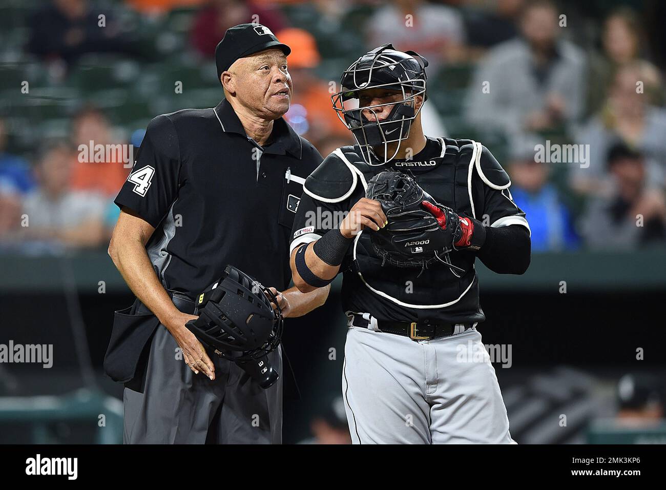 Chicago White Sox catcher Wellington Castillo talks with home plate