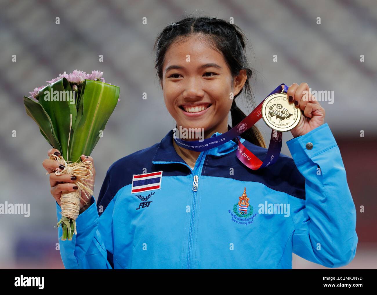 Thailand's Parinya Chuaimaroeng celebrates with her gold medal for the