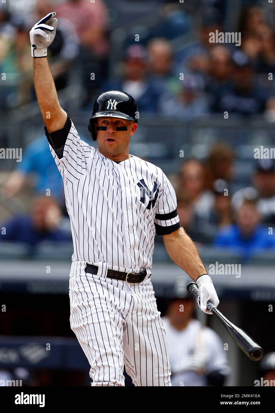 New York Yankees' Brett Gardner starts his head-first slide into third base  after hitting a triple in the first inning against the Kansas City Royals  on Sunday, August 17, 2008, at Yankee