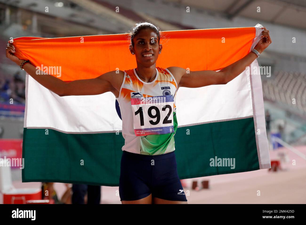 India's Poovamma Raju Machettira celebrates after winning the bronze