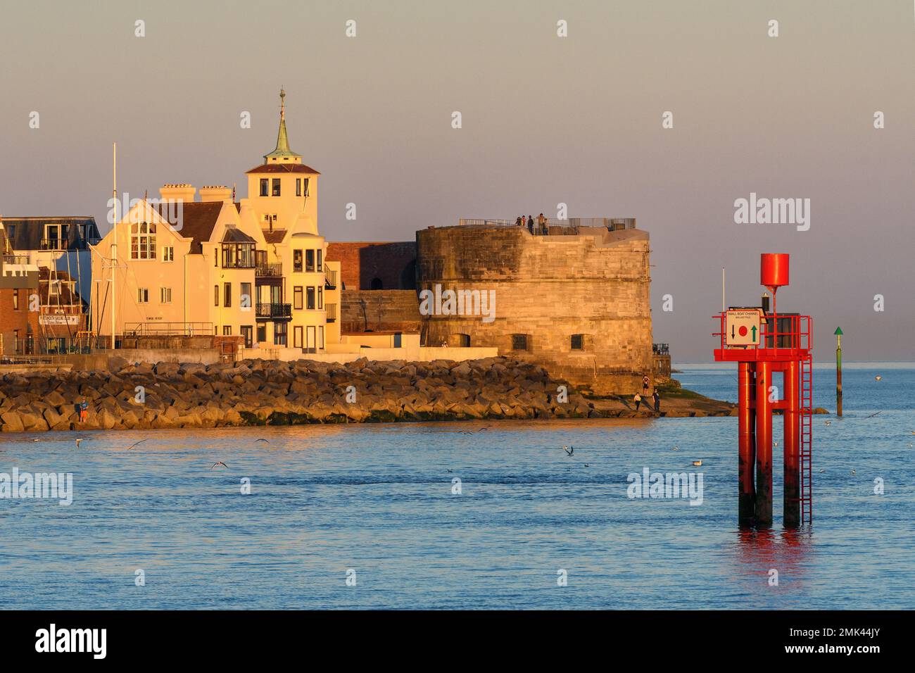 A sunset view of the Round Tower and Tower House at the entrance to Portsmouth Harbour. Stock Photo